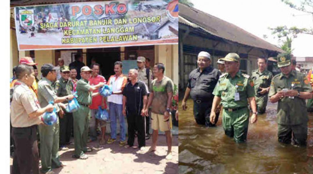 Bupati Harris Serahkan Bantuan Kepada Korban Banjir di Kelurahan Langgam