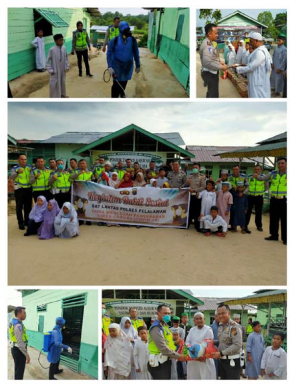 Sat Lantas Polres Pelalawan Lakukan Penyemprotan Disinfektan dan Bantuan Sembako di Yayasan Tahfiz Al-Quran