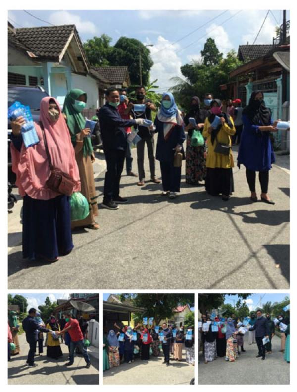 Faisal SE,M.Si Bagi-Bagi Ribuan Masker ke Masyarakat Pangkalan Kerinci 