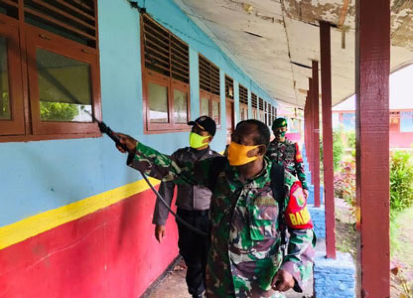 Satgas Yonif 125/SMB Gandeng Babinsa, Babinkamtibmas dan Kepala Kampung Cegah Penyebaran Covid-19