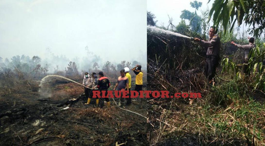 Personil Polsek Bangko Padamkan Api dan Buru Pelaku Pembakar Lahan
