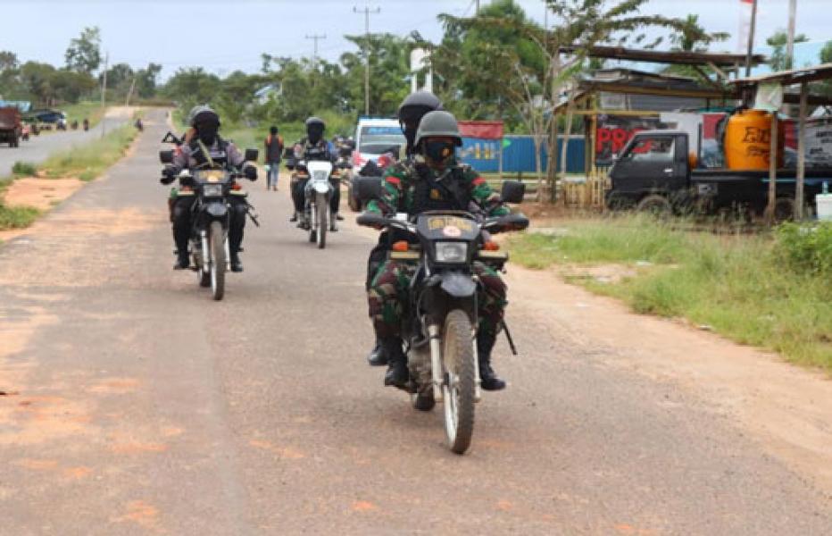 Cegah Covid-19 dan Ciptakan Rasa Aman, TNI-Polri Lakukan Patroli di Kabupaten Mappi Papua