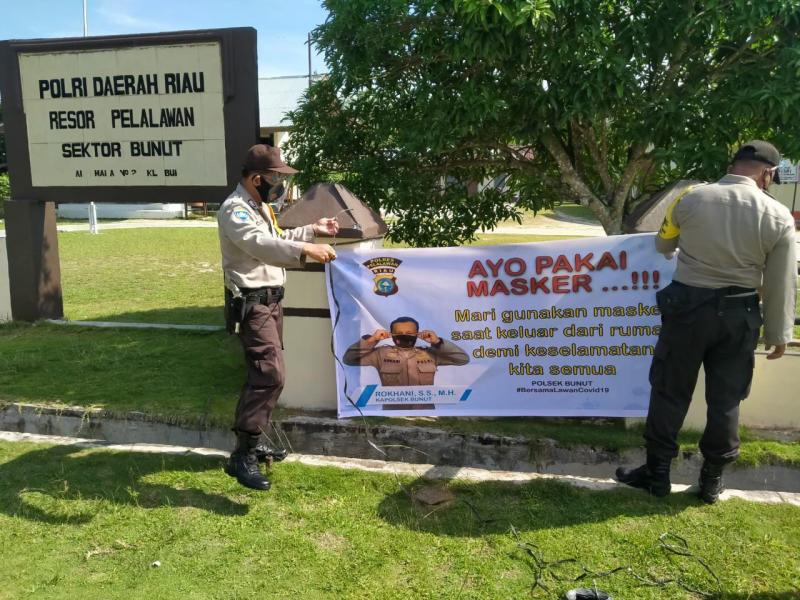 Polsek Bunut Giatkan Operasi Yustisi dan Pemasangan Spanduk Hinbauan Penggunaan Masker