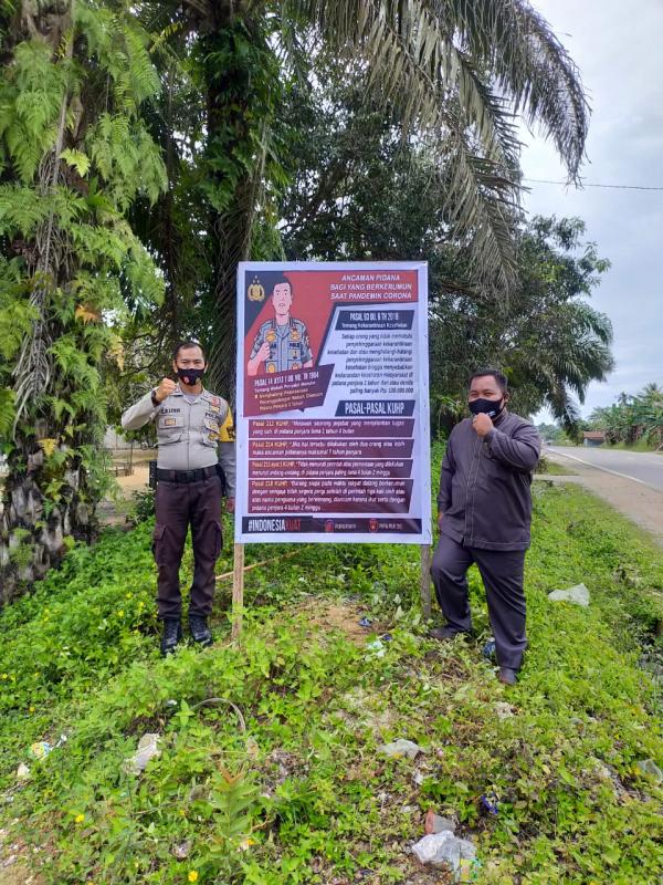 Polsek Pangkalan Lesung Sosialisasikan Maklumat Kapolri dan Pasang Spanduk Pendisiplinan Bagi Pelanggar Protokol kesehatan