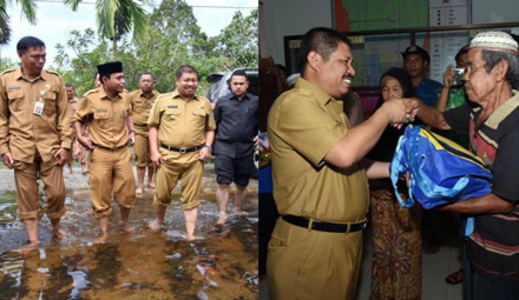 Bupati Amril Serahkan Bantuan Kepada 324 KK Korban Banjir Teluk Latak