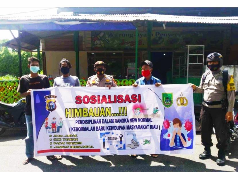Personil Polsek Bangko Lakukan Sosialisasi dan Himbauan Prokes Covid-19 di Wilayah Hukumnya