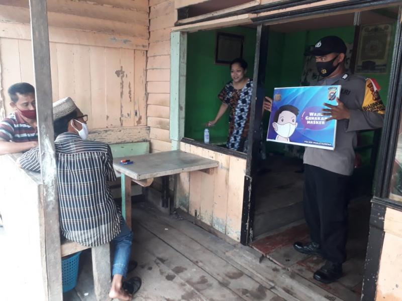 Personel Polsek Kuala Kampar Gencar Giat Sosialisasi Covid 19 Jelang Tahun Baru