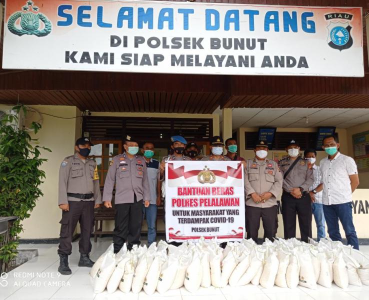 Polsek Bunut dan Yayasan Budha Tsu Chi Indonesia Laksanakan Baksos ke Warga Yerdampak Covid-19